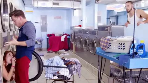 Ginger-haired is providing a dt at the laundromat