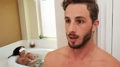 Trying to hide his full salute from the huge-boobed MILF