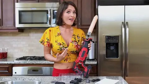 Prepping to bang the dark-haired babe with a machine